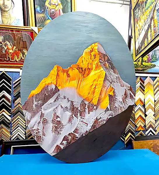 Custom oval canvas painting stretched over a shaped wooden frame in Singapore.