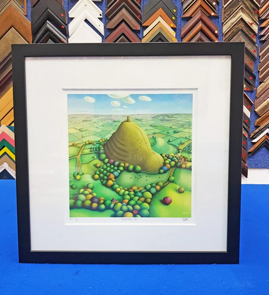 Custom picture framing with a single white matboard border enhancing artwork in Singapore.