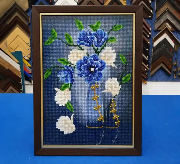 Diamond art painting professionally direct framed with a wooden picture frame.