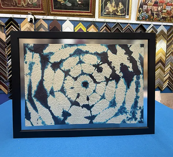 Paper artwork professionally double glass framed with a floating effect in Singapore.