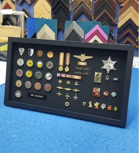Military medals, badges, and insignia professionally framed in Singapore