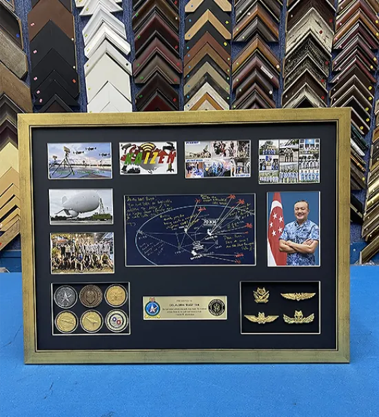 Custom memorabilia framing with photographs, medals, badges, and keepsakes in Singapore.