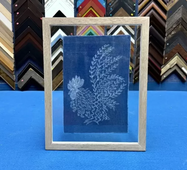 TTextile artwork professionally double glass framed with visible floating edges in Singapore.