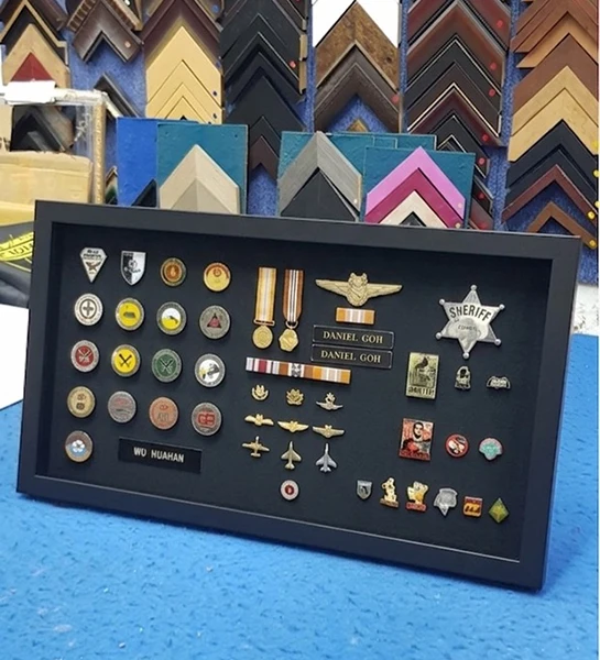 Custom military badge and medal framing with insignia display.