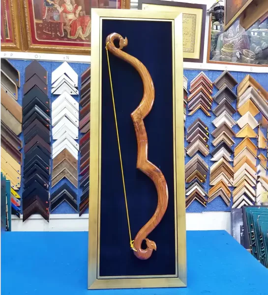 Traditional bow custom shadow box framing for cultural artefacts and handcrafted collectibles.