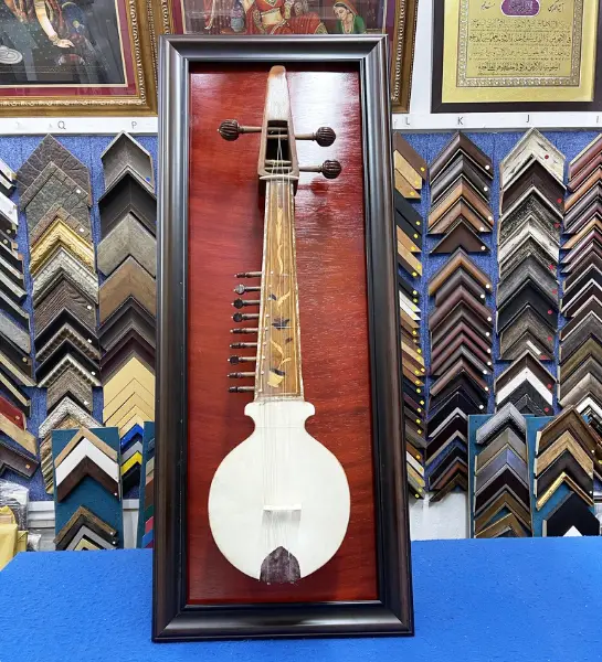 raditional musical instrument professionally framed in a custom shadow box display in Singapore.