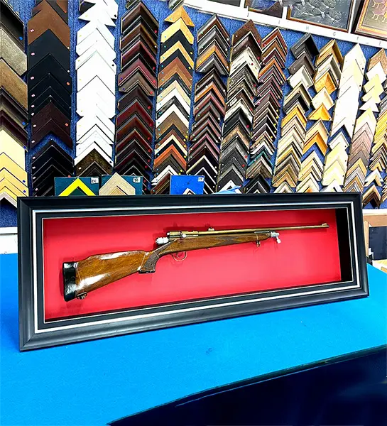 Vintage rifle preserved in a custom shadow box display frame for collectors in Singapore.